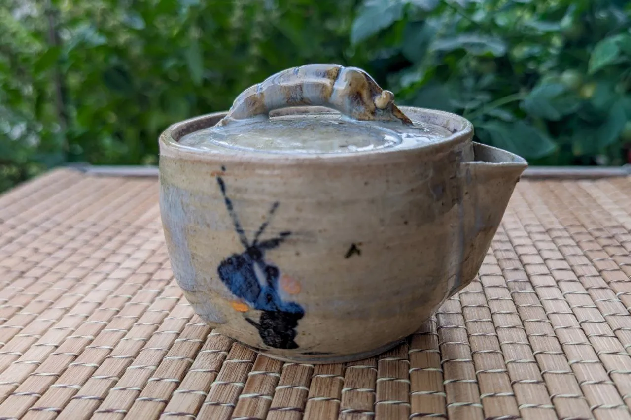 Clay teapot with a shrimp-shaped lid