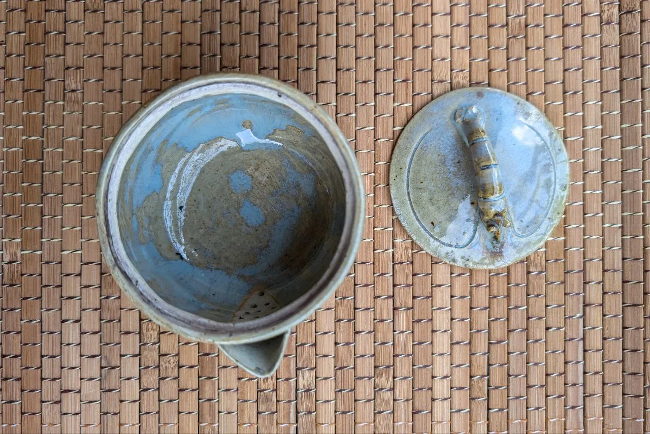 Clay teapot with a shrimp-shaped lid